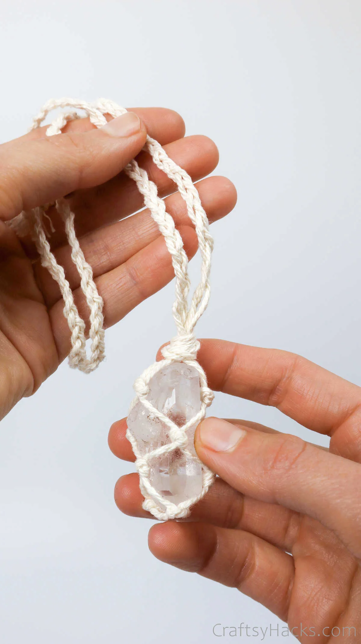 holding macrame necklace