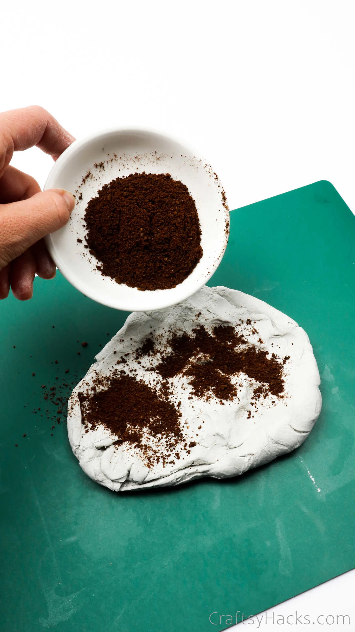 adding coffee grounds