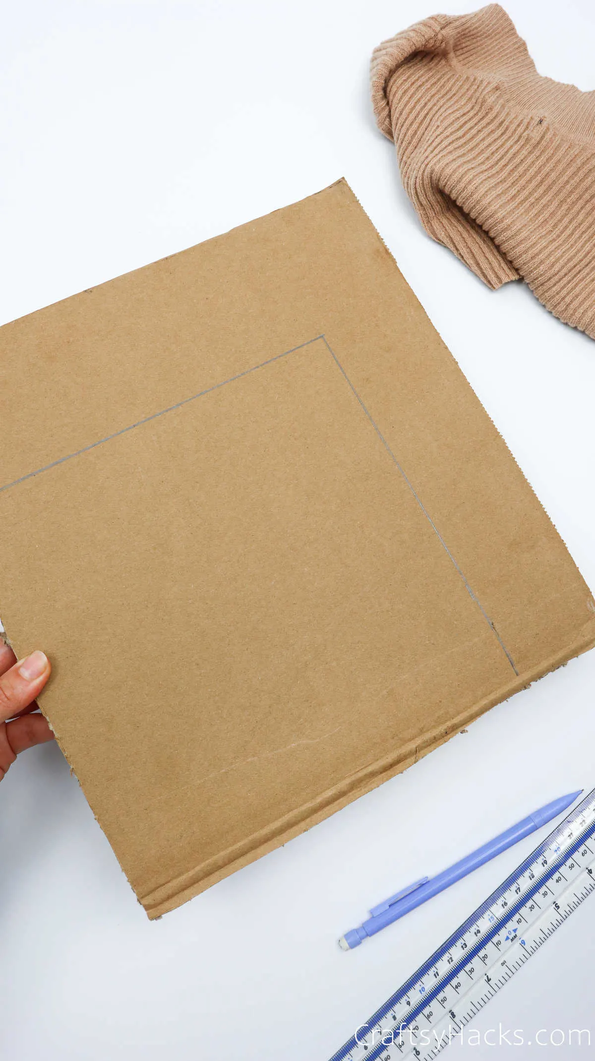 tracing box shape on cardboard