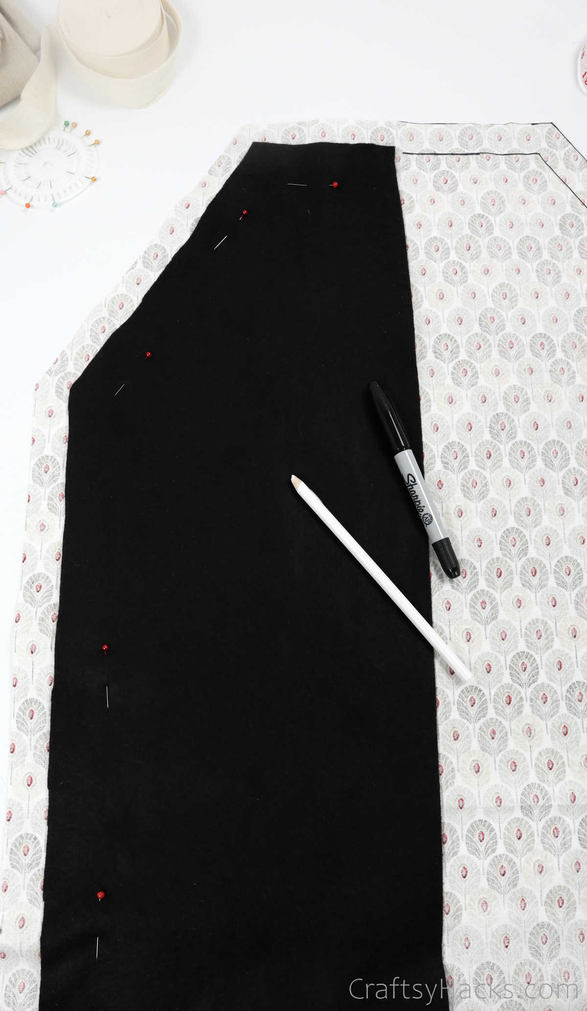 pinning black fabric to other side