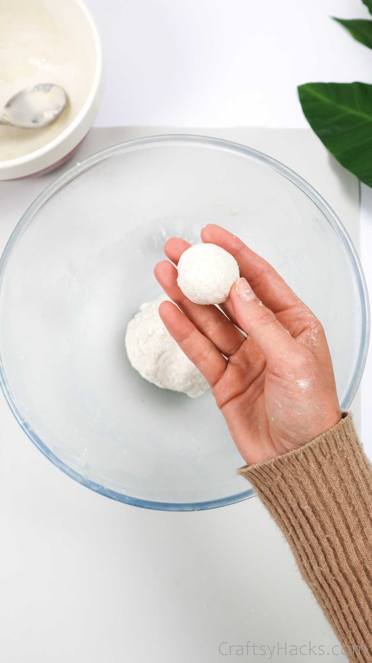 holding paper mache ball