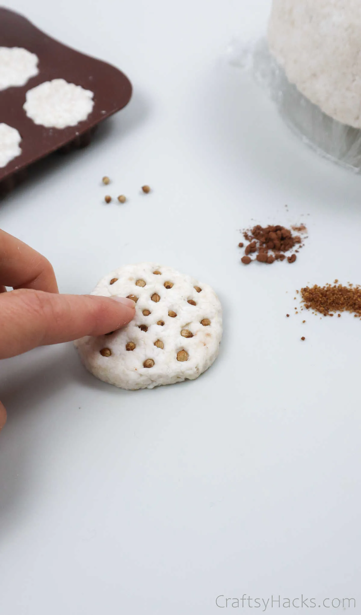 pressing seeds into paper