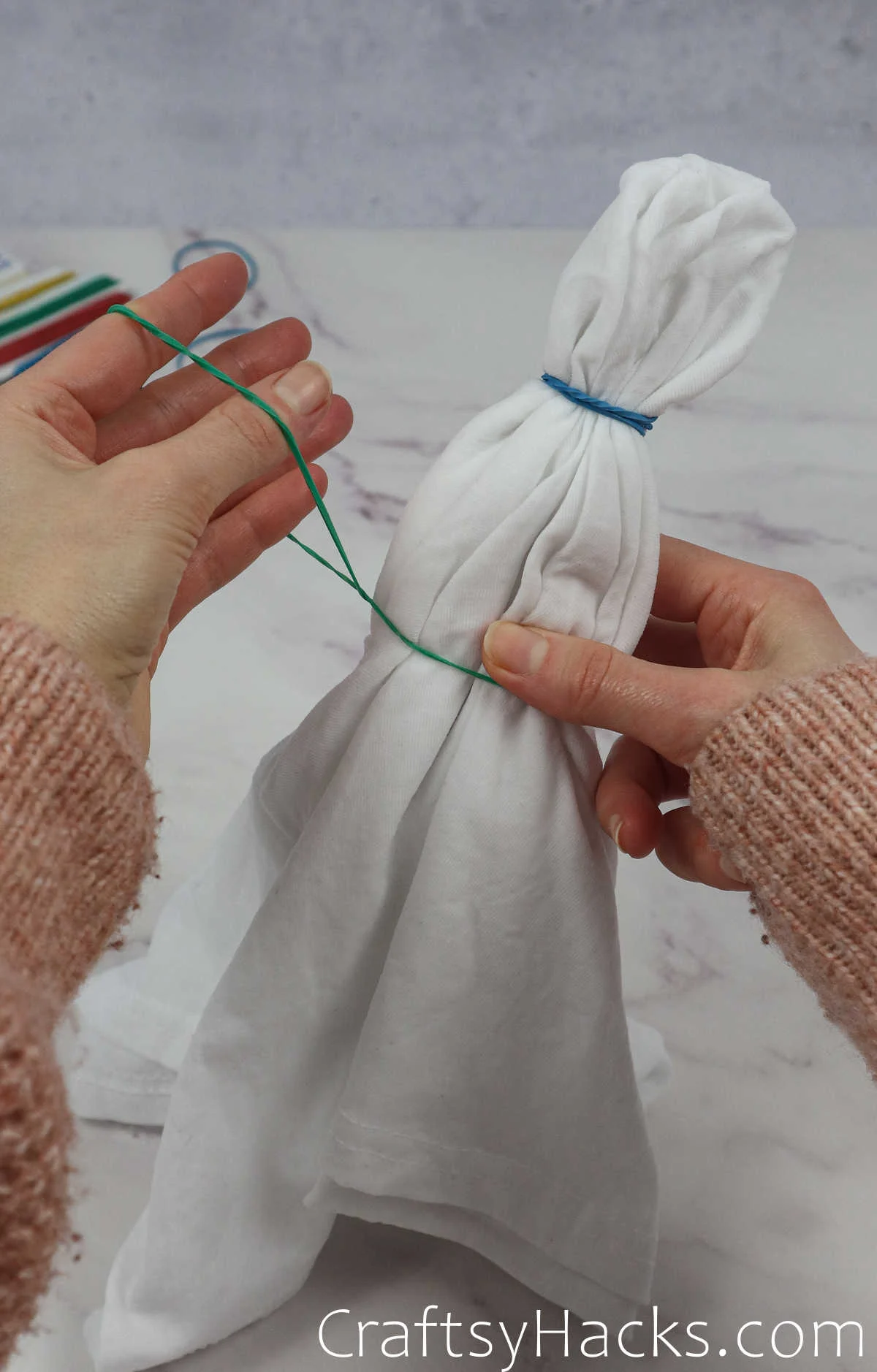 putting rubber band on shirt