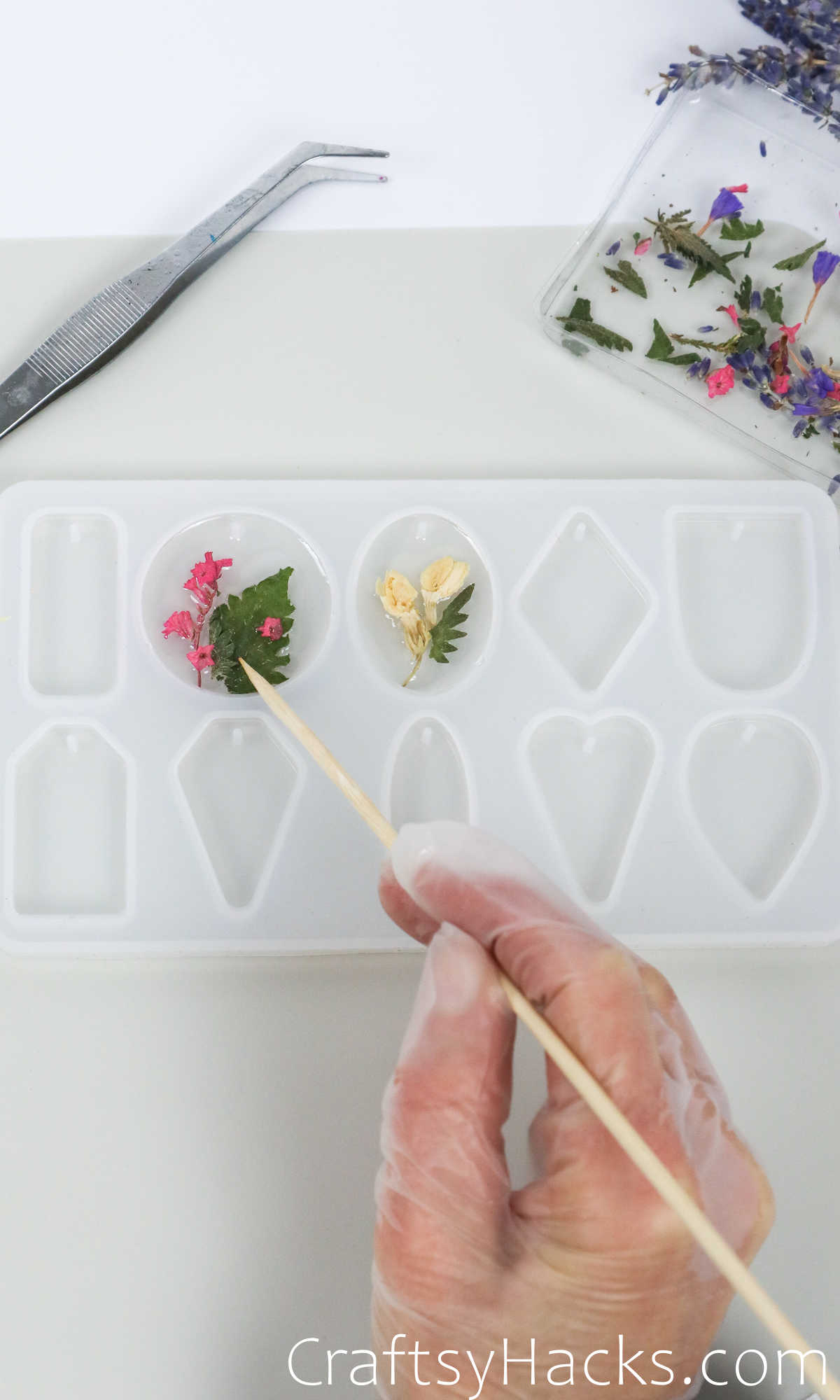 placing flowers in resin