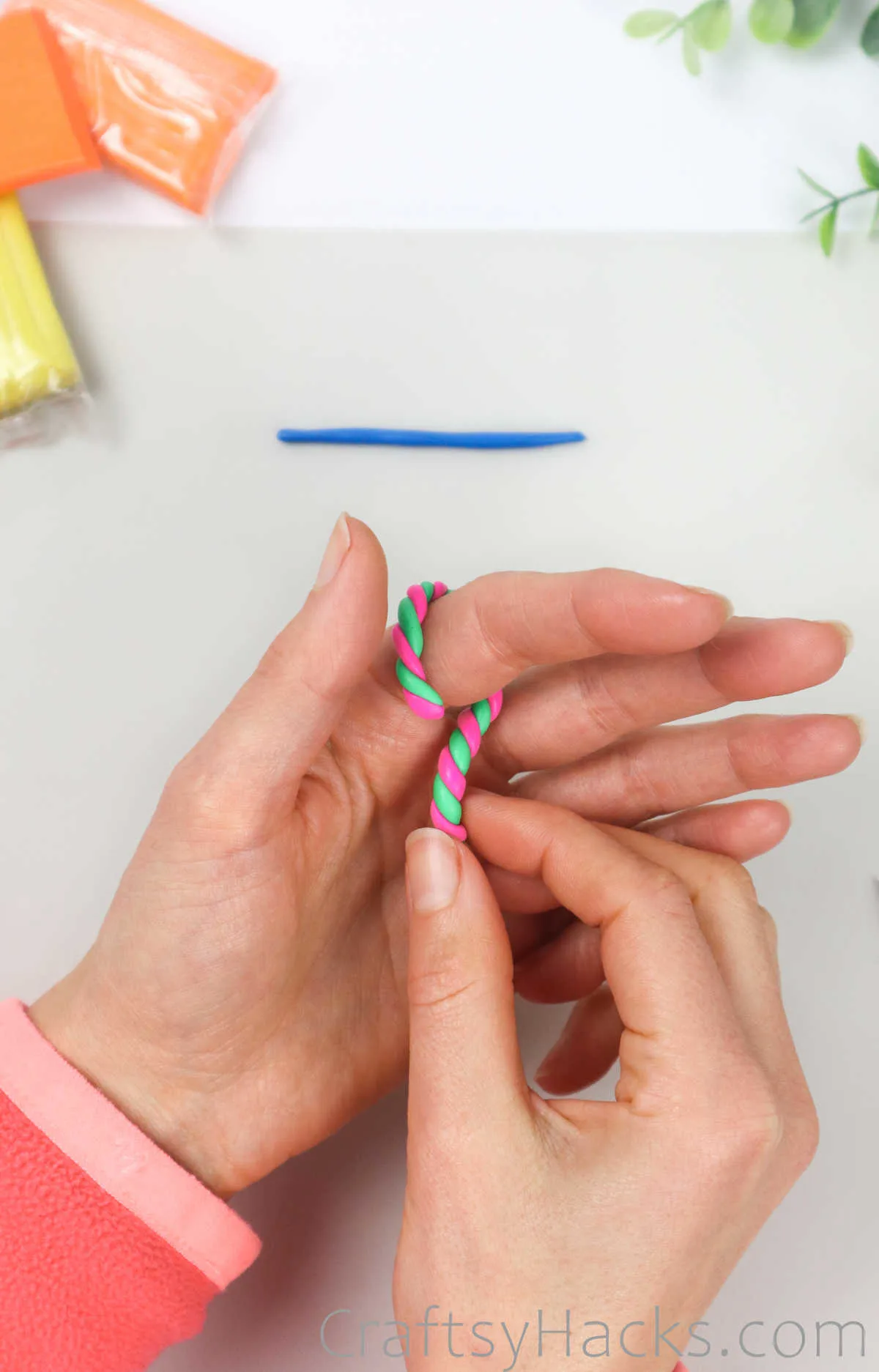 wrapping clay around finger