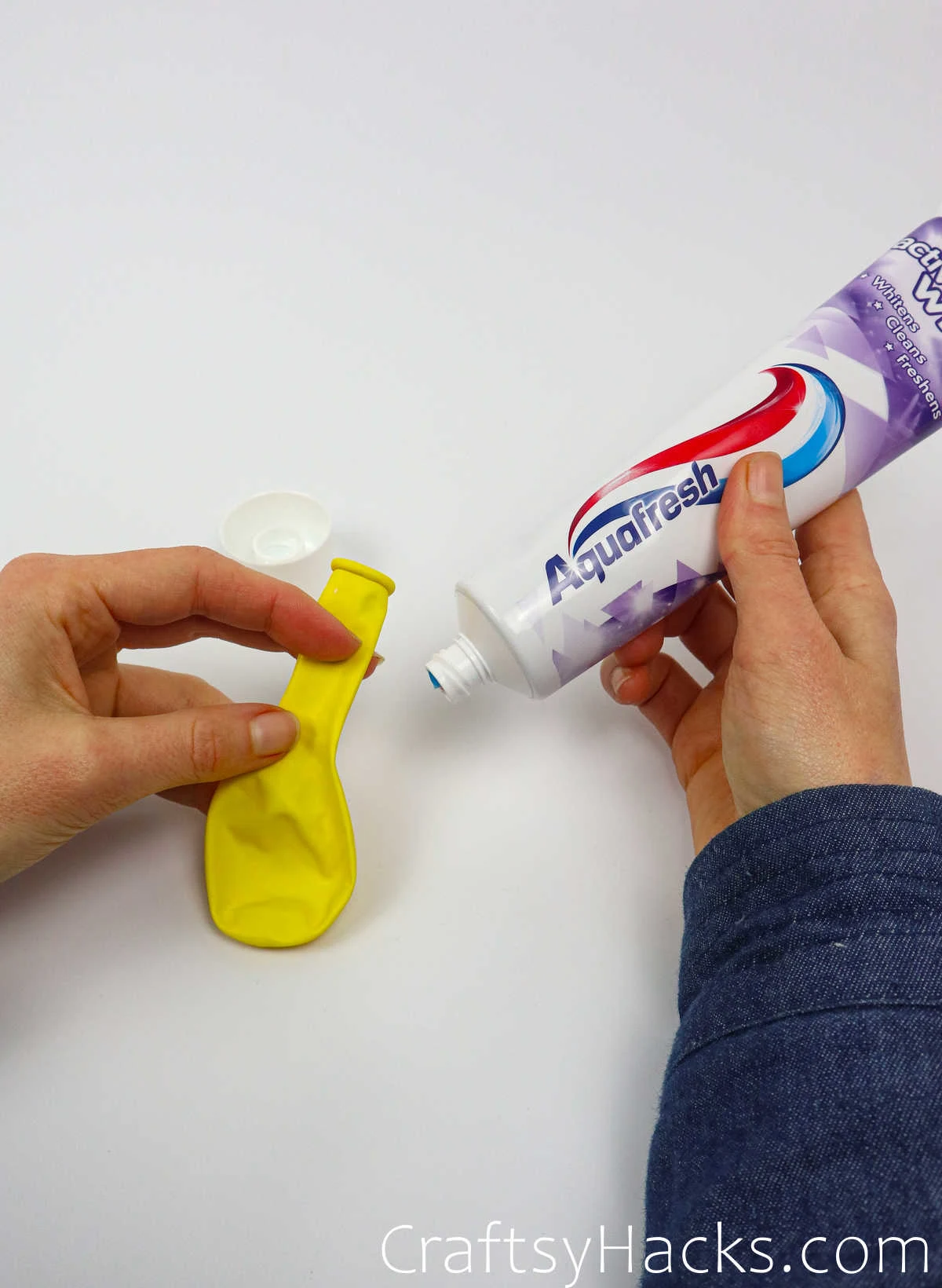 holding toothpaste tube