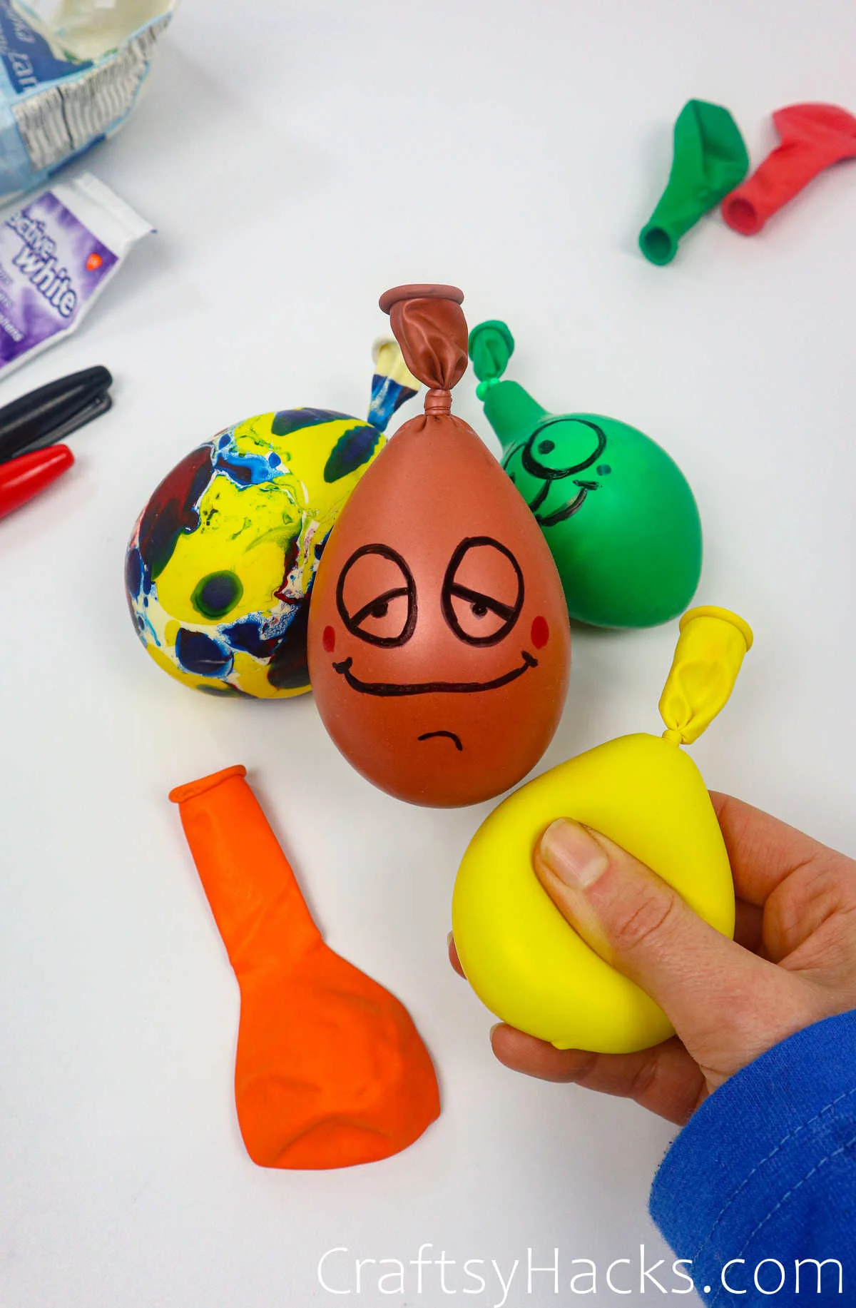 holding yellow stress ball