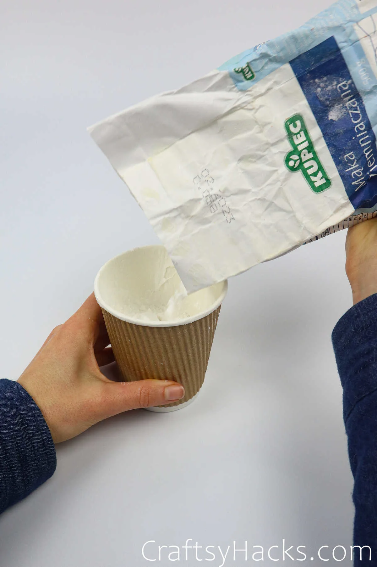 pouring flour in cup