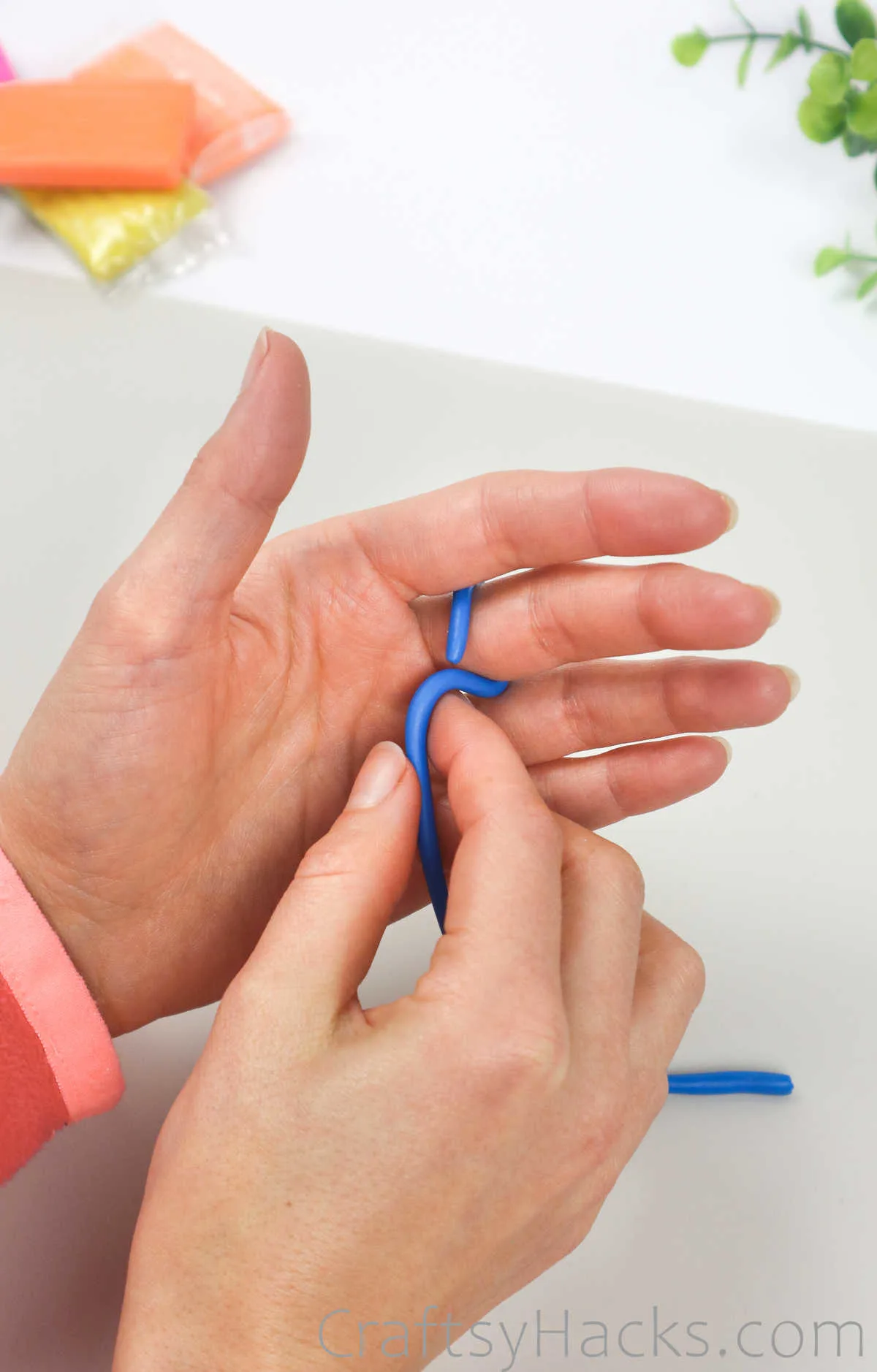 wrapping clay around finger