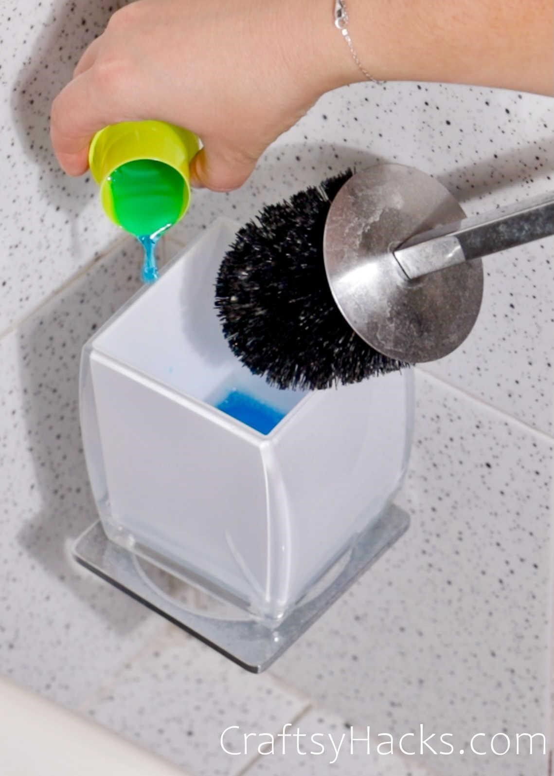 soak toilet brush with favorite cleaner