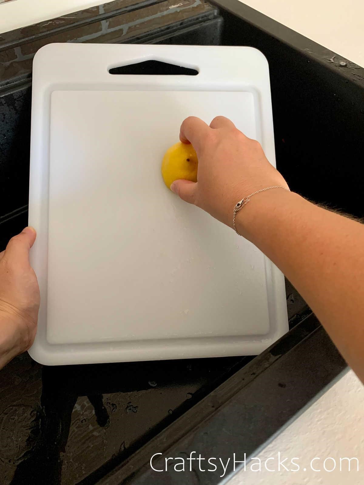 sanitizing cutting board with lemon