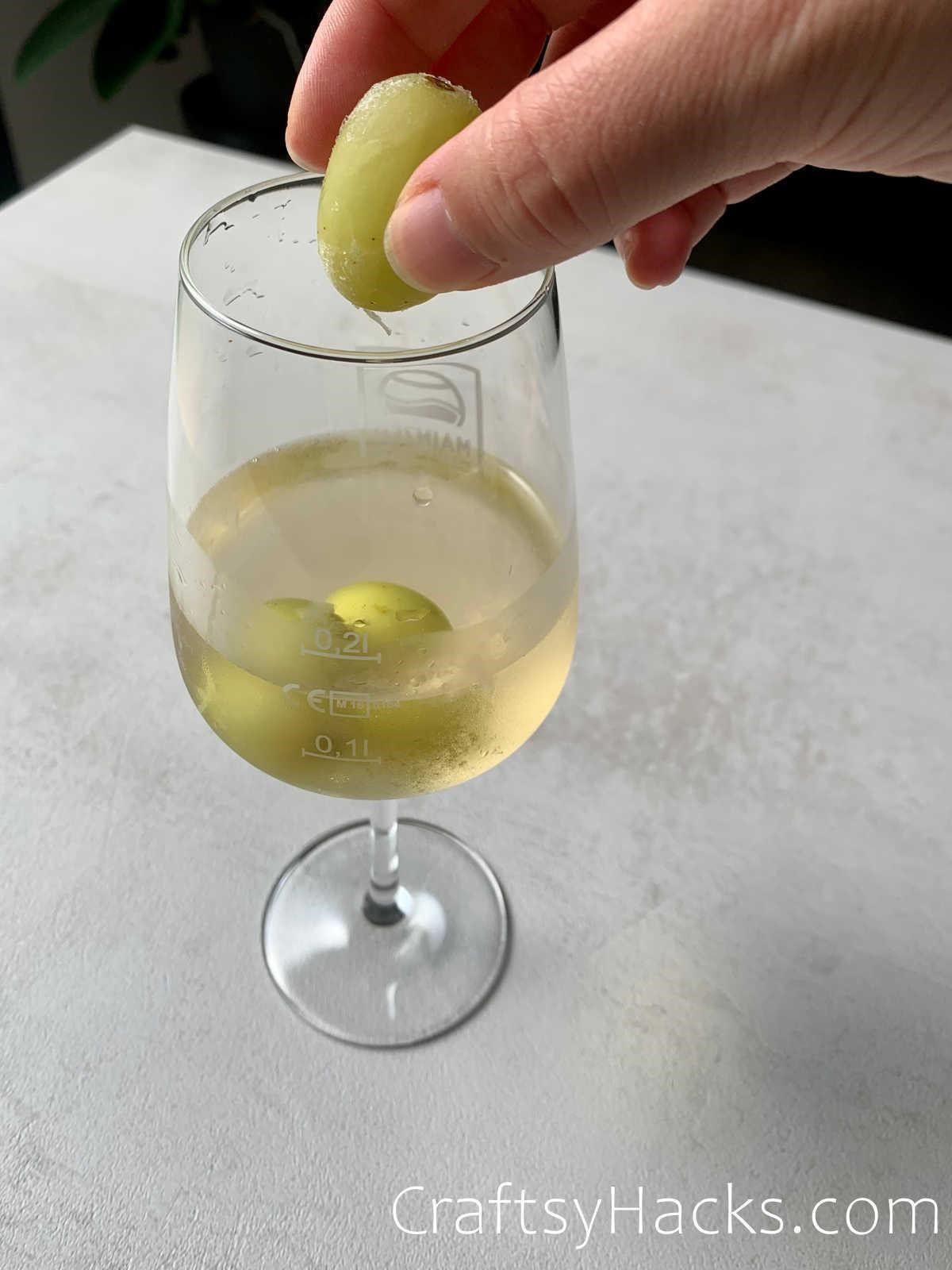 use frozen grapes to cool wine