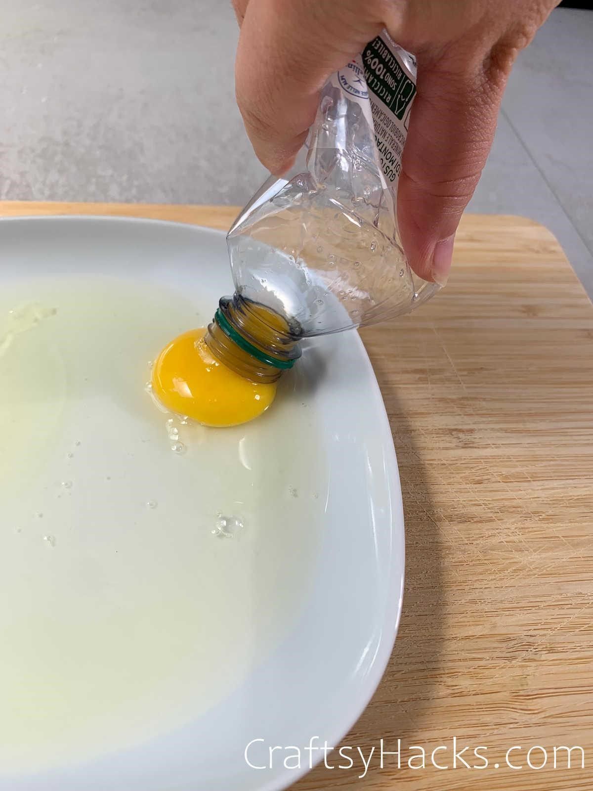 seperate egg yolk from white with a bottle