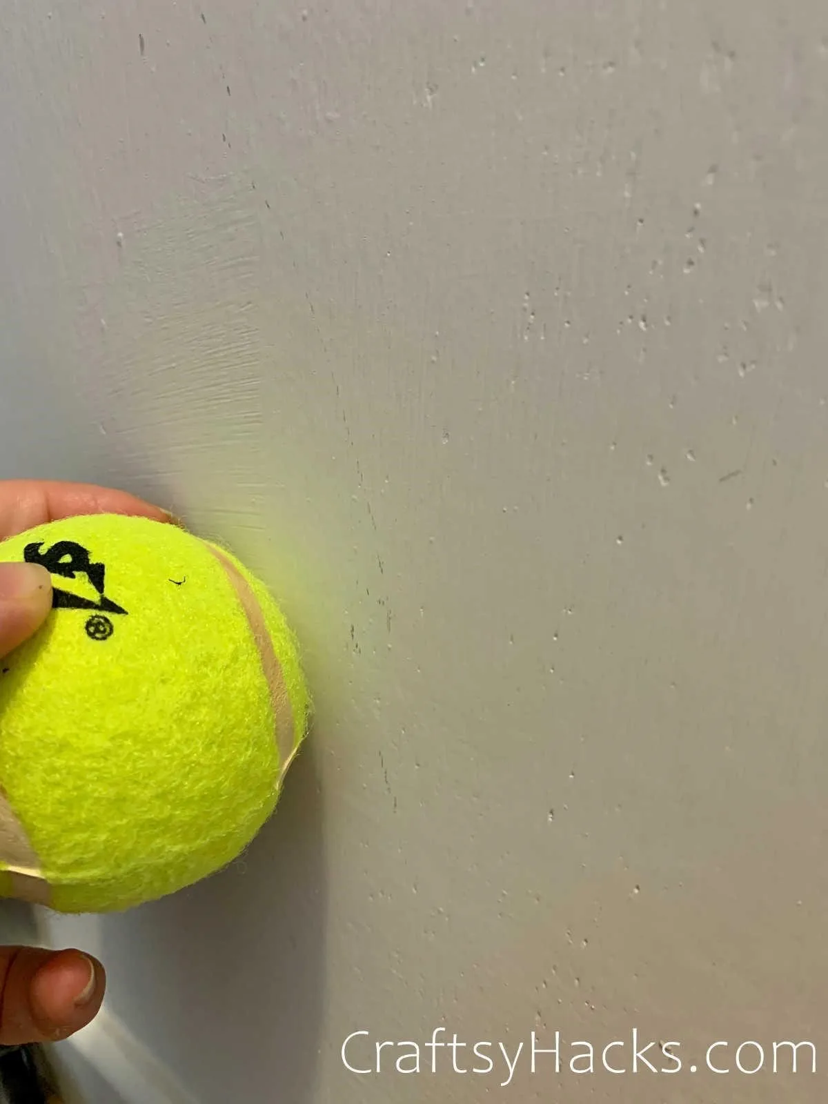 remove scuff marks on the wall with a tennis ball