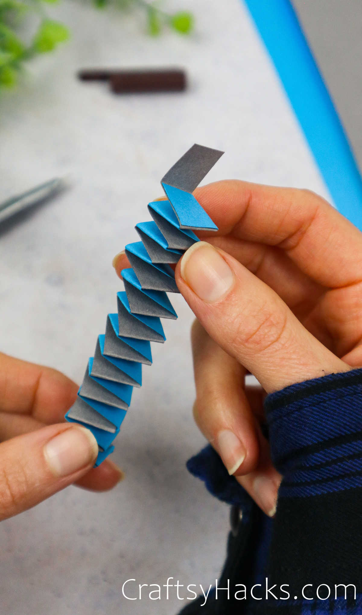 alternate strips of paper to create a spring