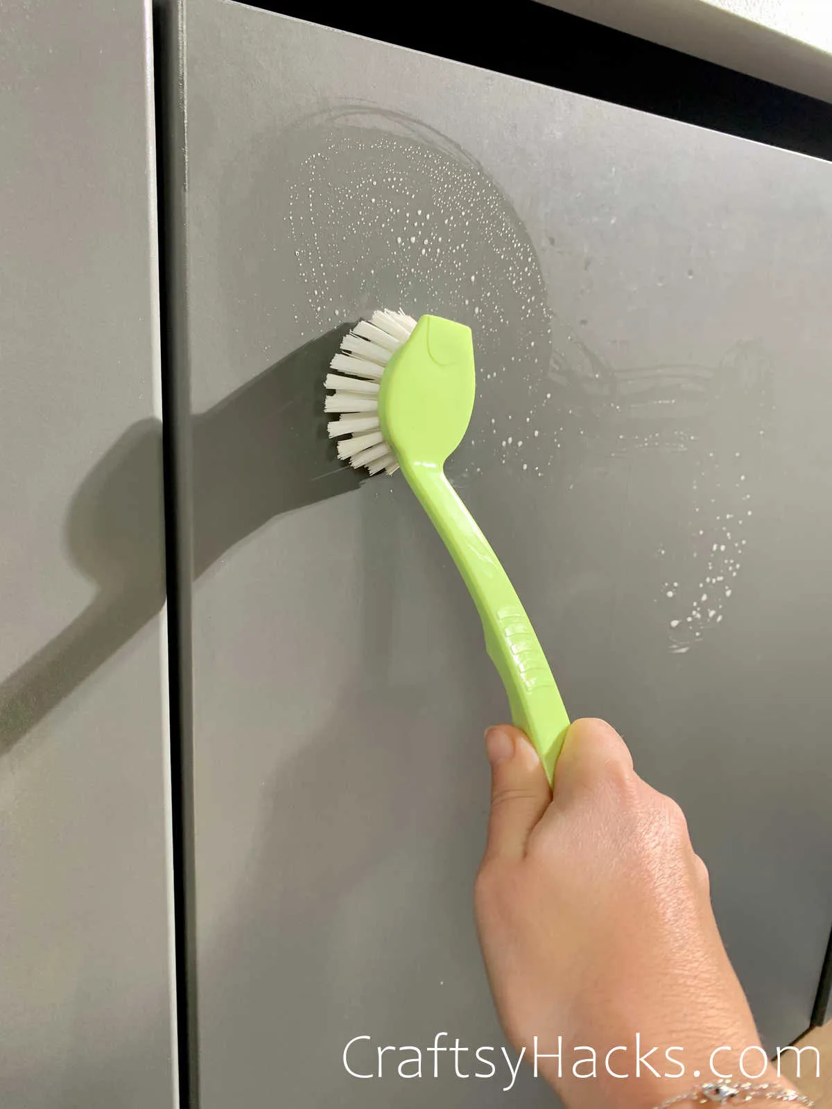 scrub front of kitchen cabinets