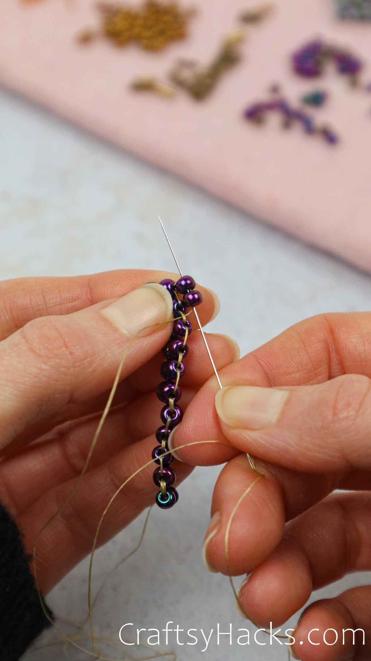 threading more beads to create a diamond shape