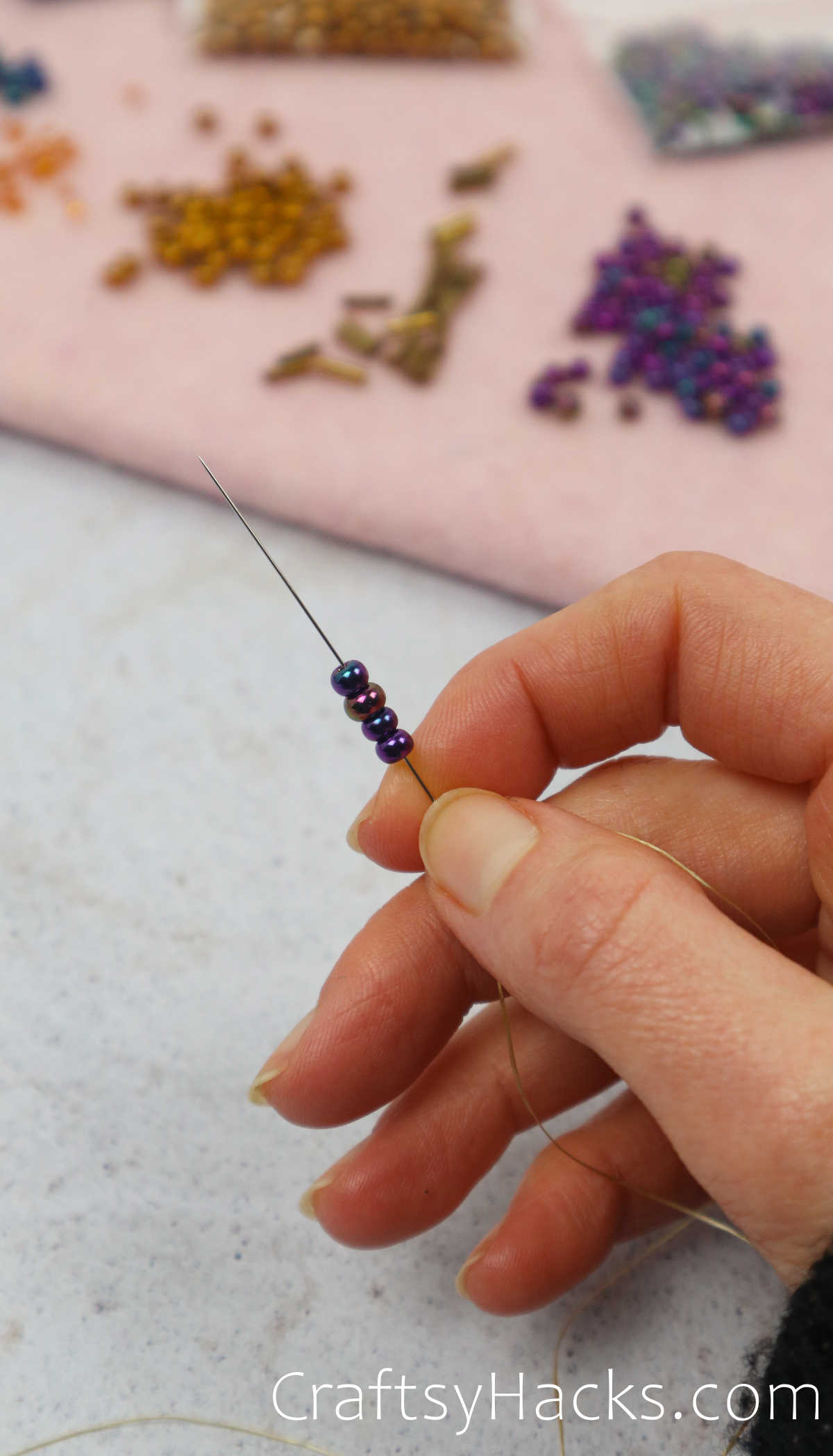 thread beads on to needle