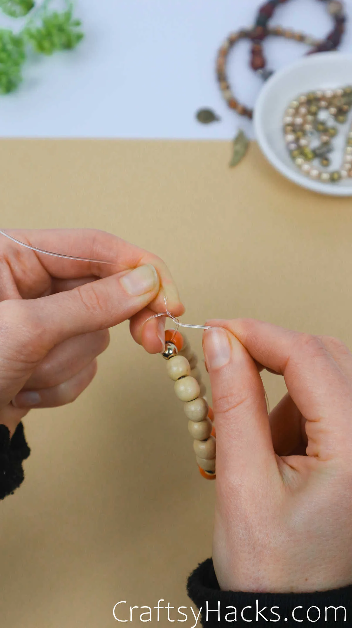 tie two knots to fasten bracelet