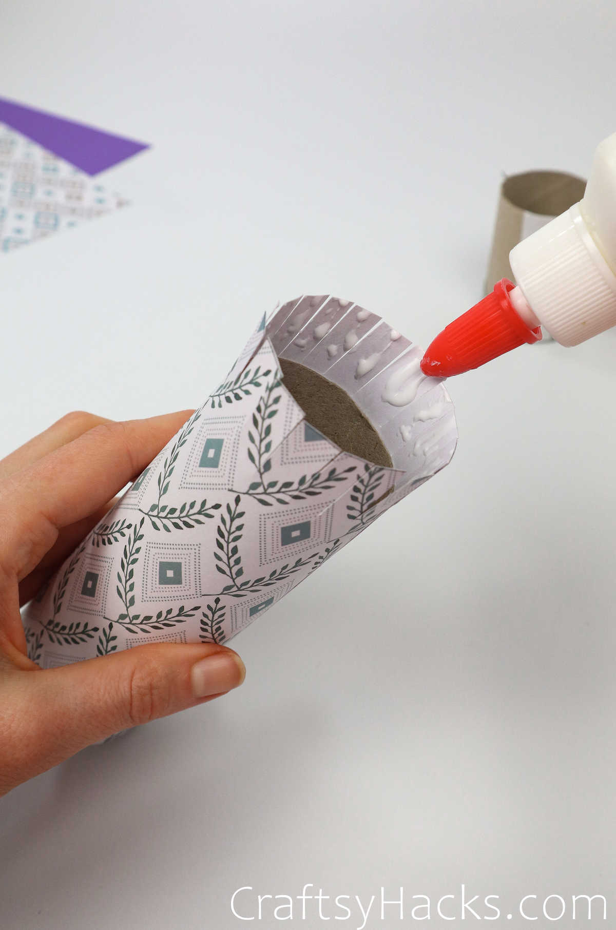 glue the strips on to toilet paper tube