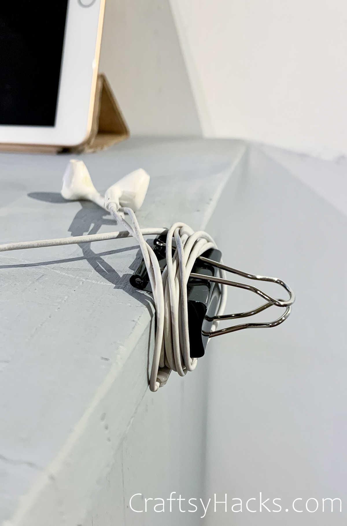 wrap up earbuds with binder clip