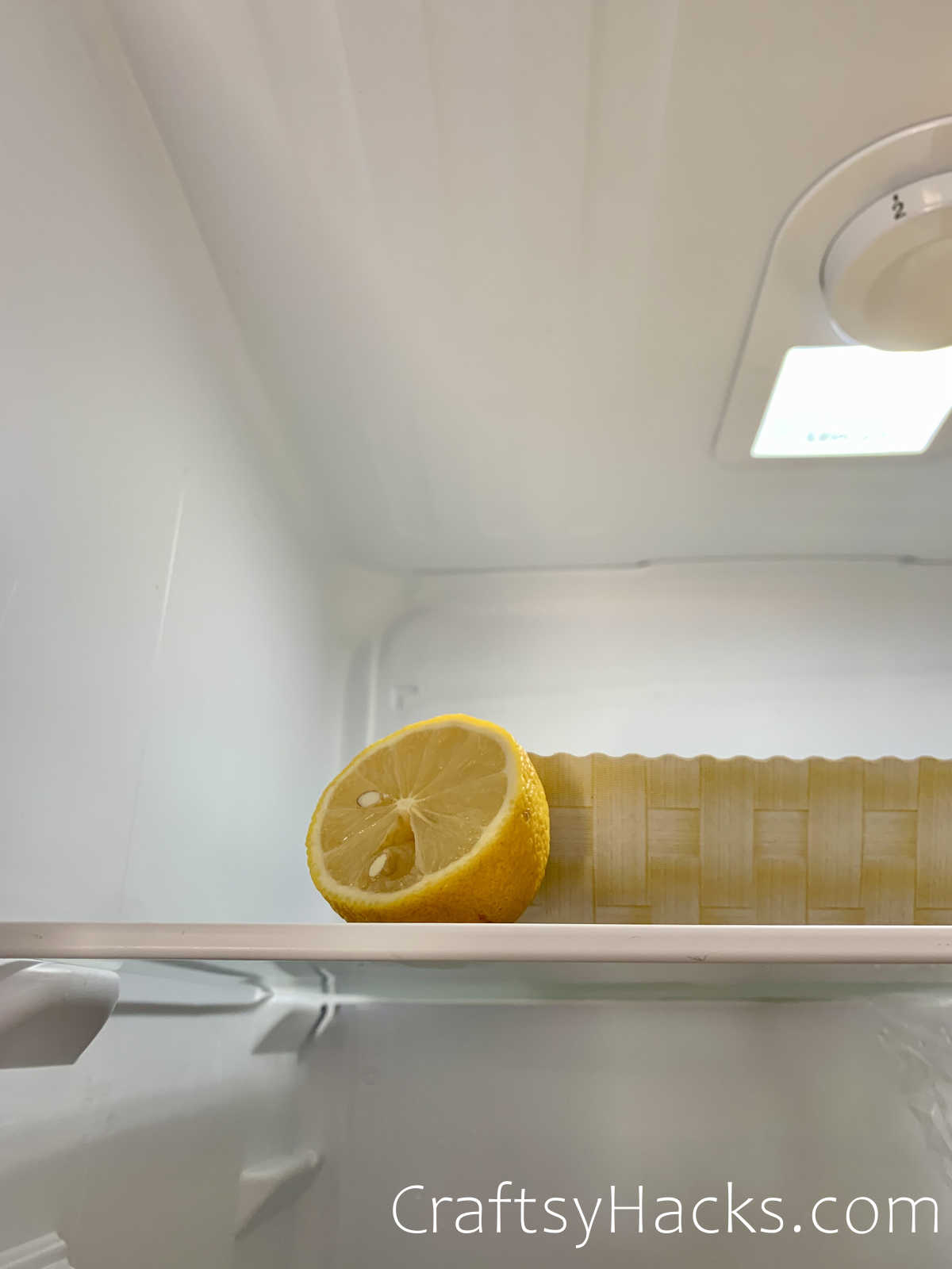 put a lemon in the fridge for a fresh smell
