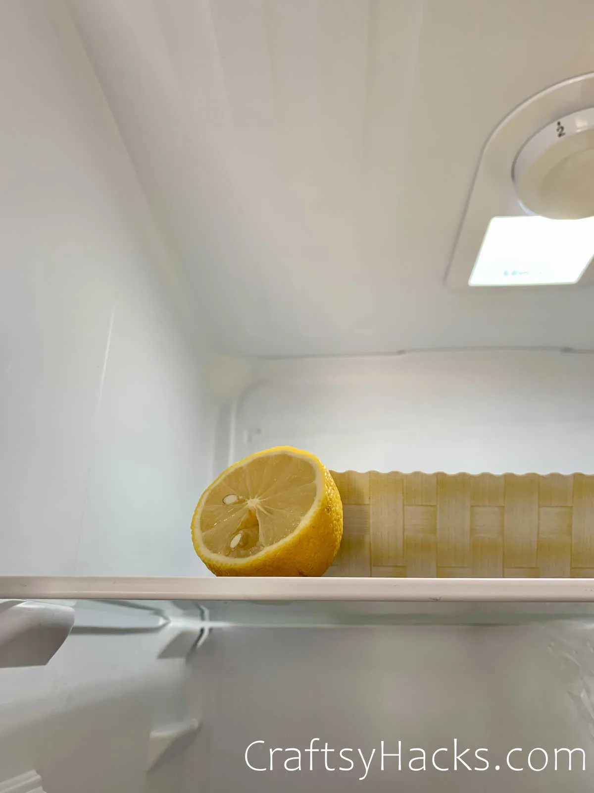 put a lemon in the fridge for a fresh smell