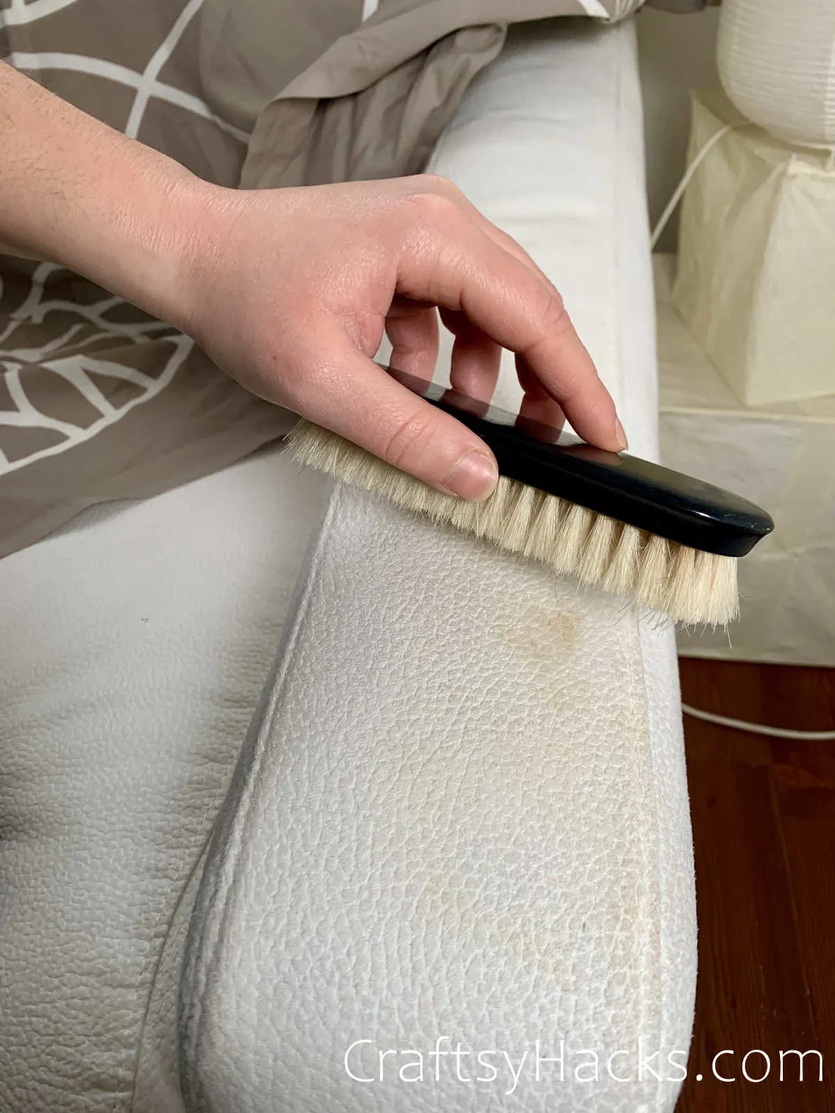 spot clean furniture with a brush and rubbing alcohol