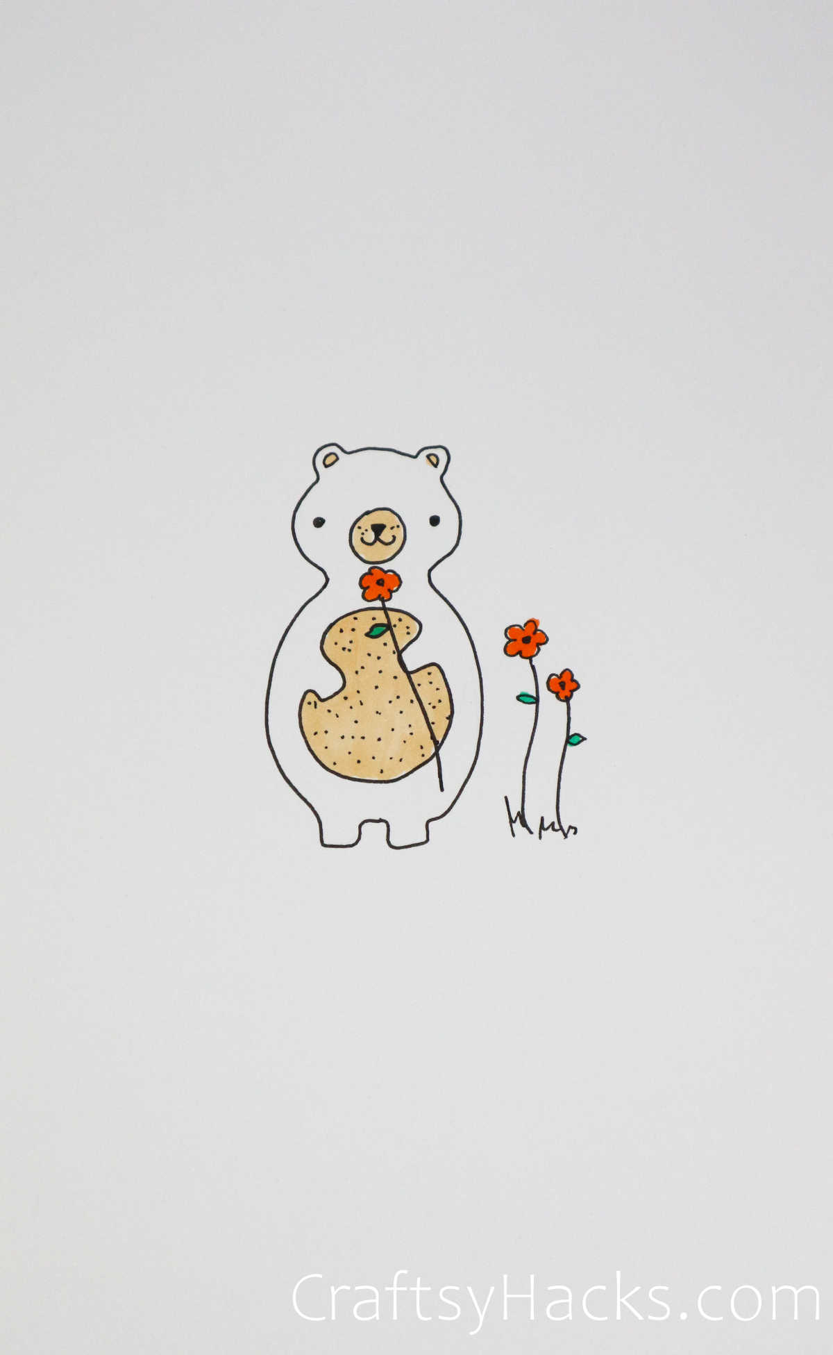 bear smelling flowers