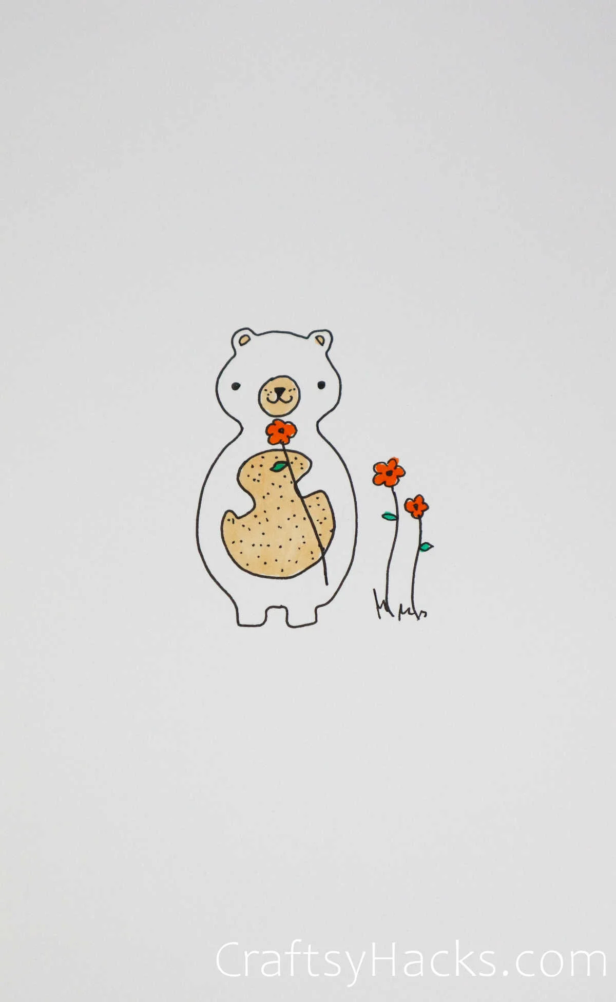 bear smelling flowers
