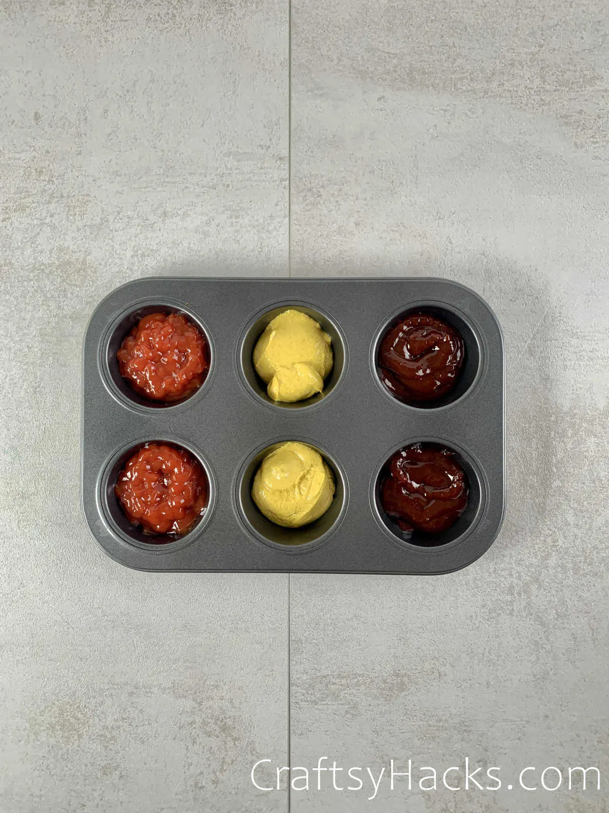easy accessible condiments in muffin tray