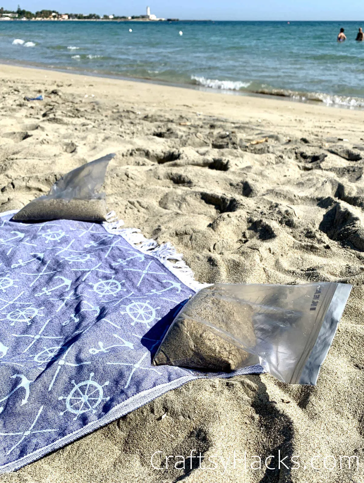 fill bags with sand as towel holders