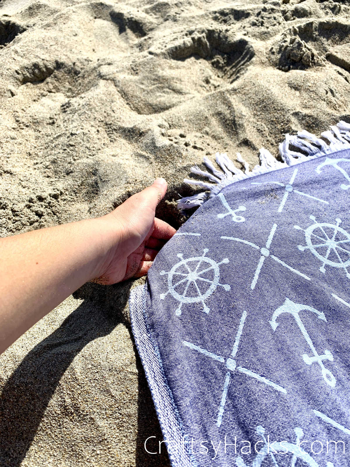 wrap corners of a towel in sand