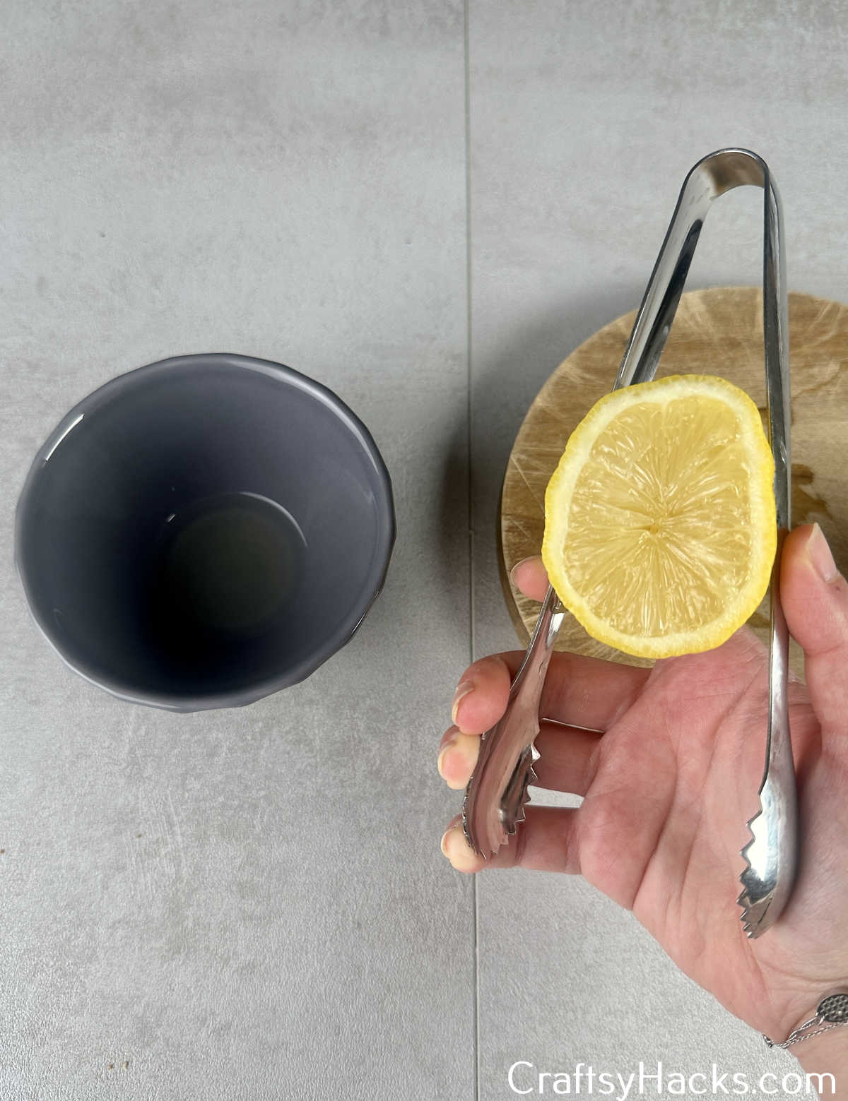 use tongs to squeeze lemon