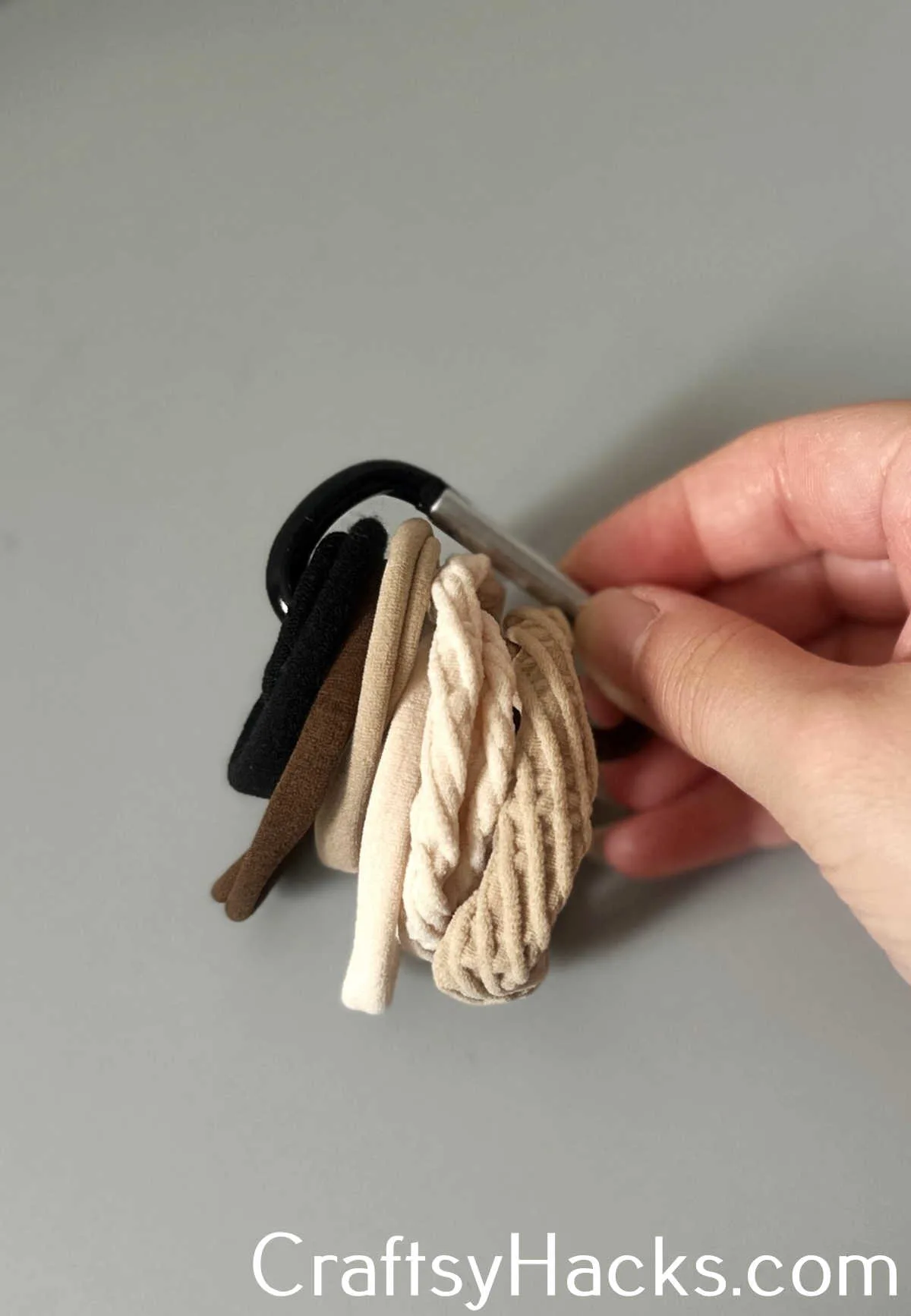 corral hair ties with carabiner