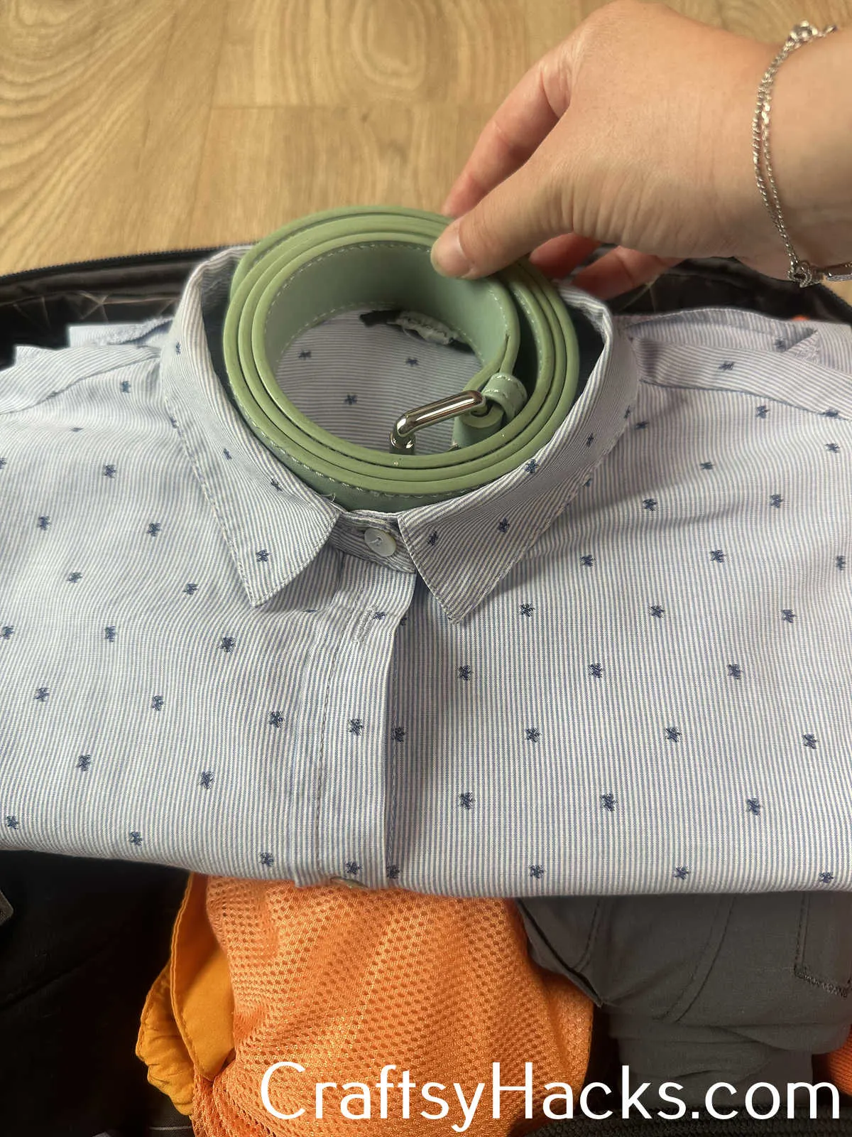 tuck belts into shirt collars