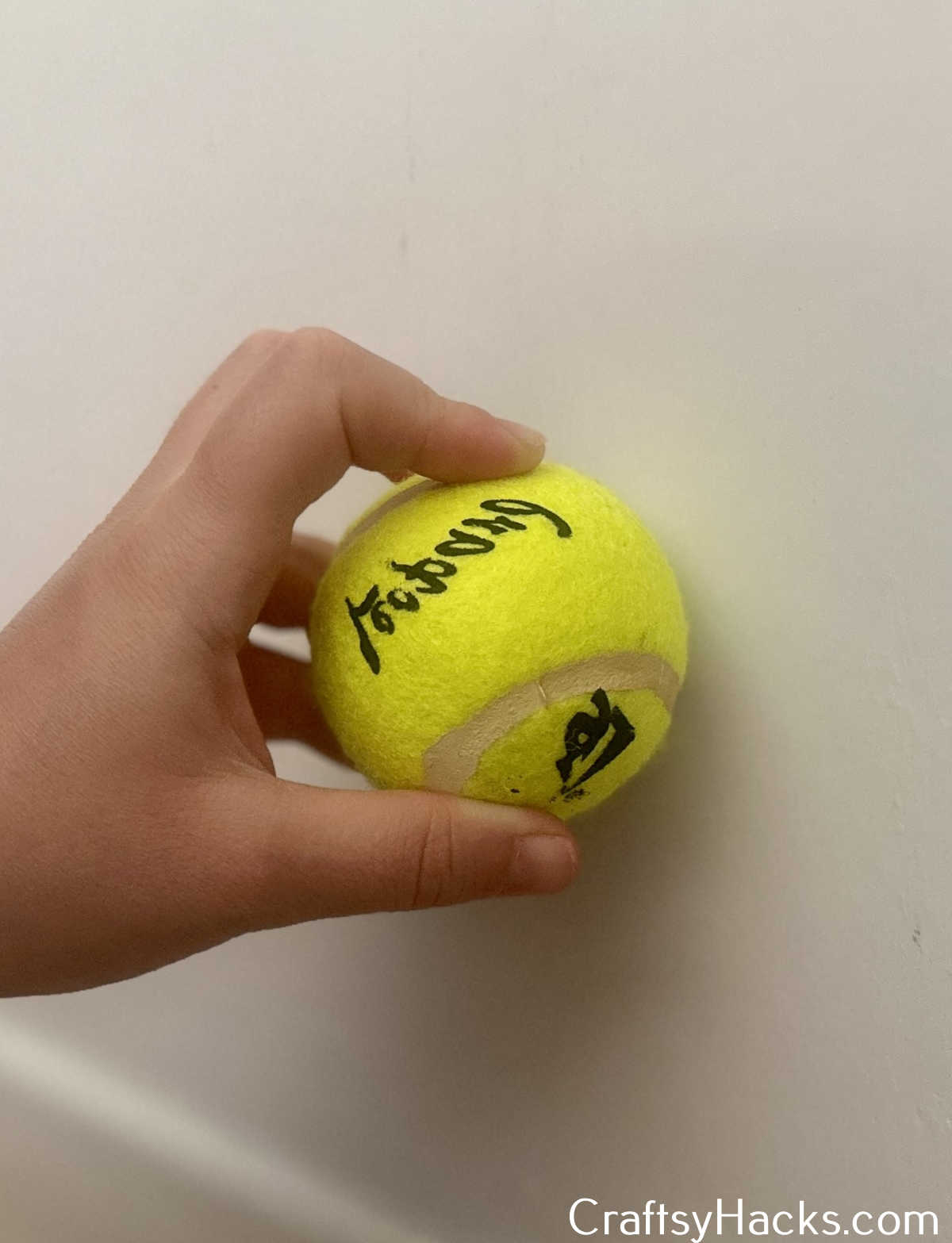 use tennis ball to remove stains from a wall