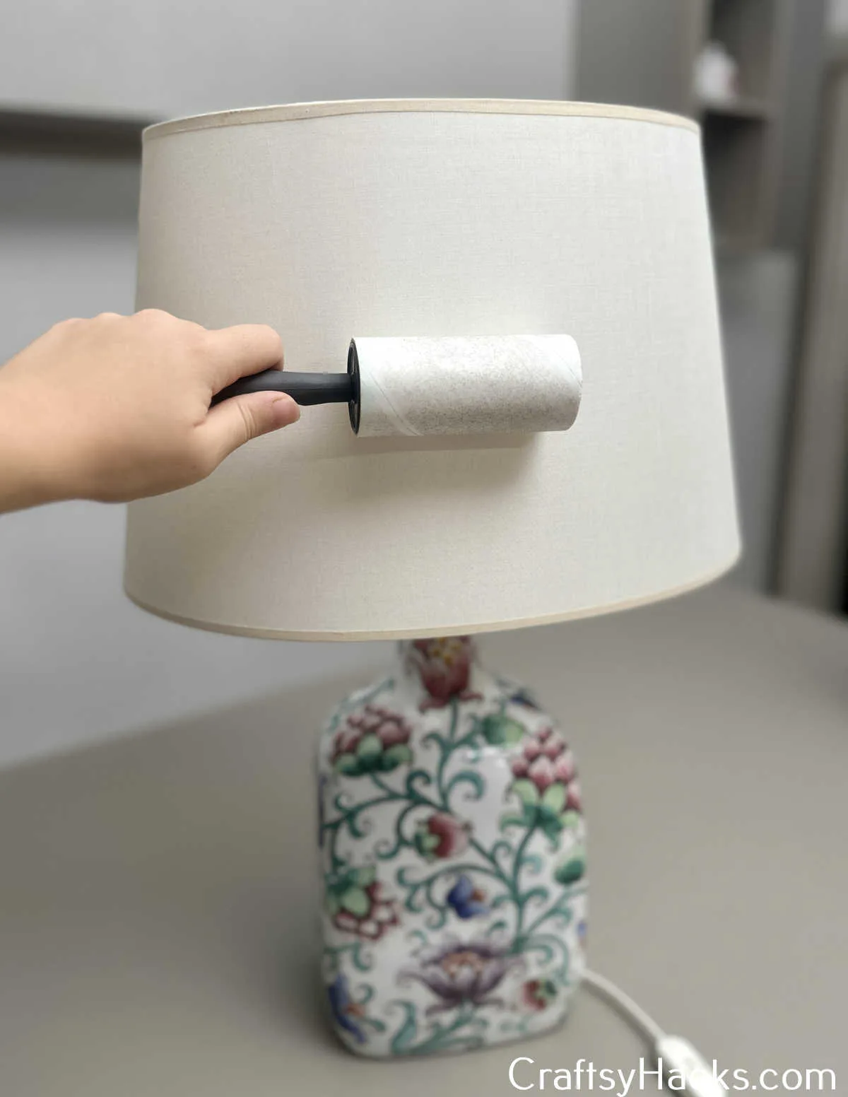 use lint roller to dust lampshade