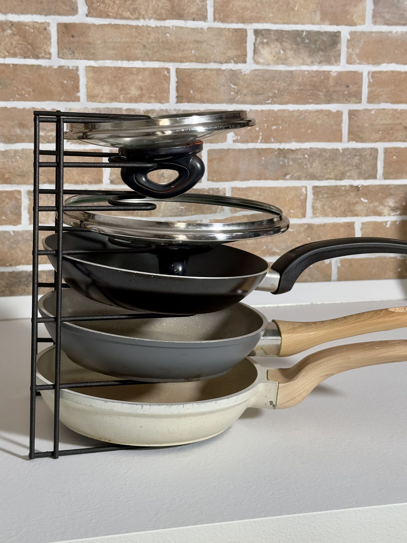 Use A Divider To Stack Pans And Lids