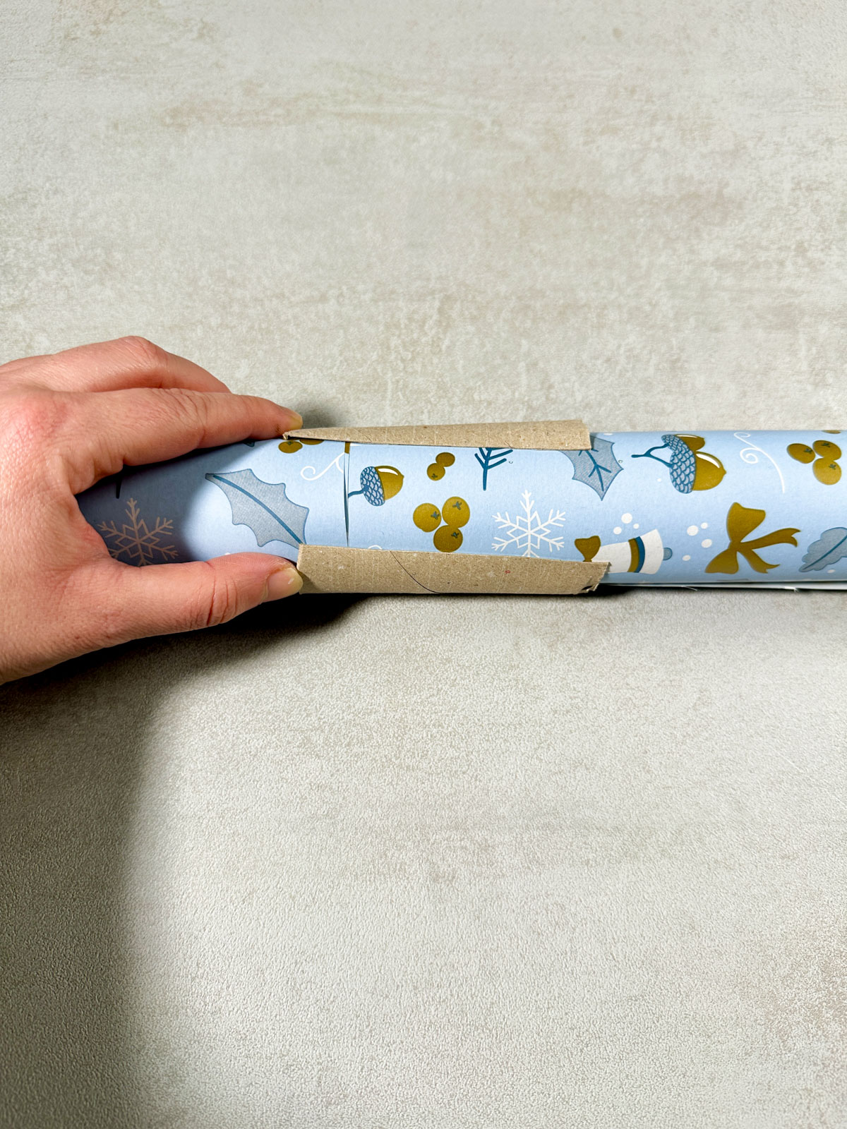 Use a Toilet Paper Roll to Store Wrapping Paper