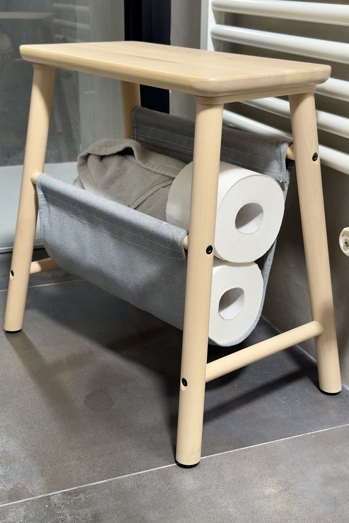 Use A Stool To Store Towels And Toilet Paper