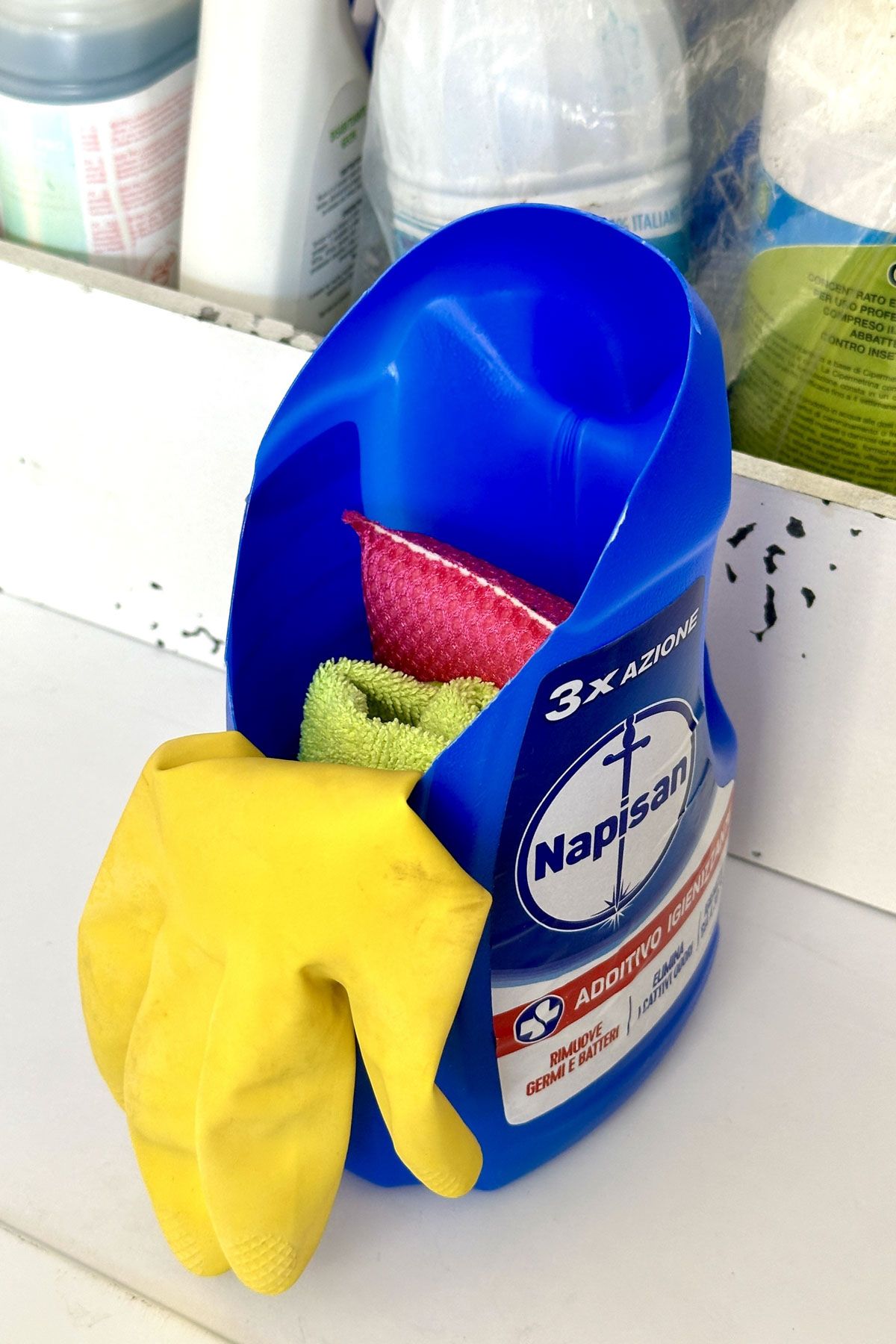 Turn An Empty Detergent Bottle Into A Container For Sponges And Gloves