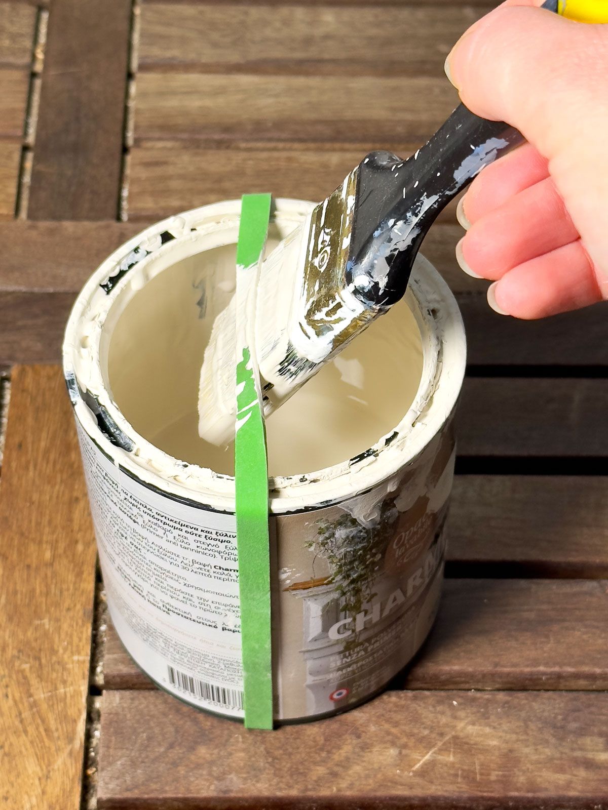 Use a Rubber Band to Remove Excess Paint from the Brush