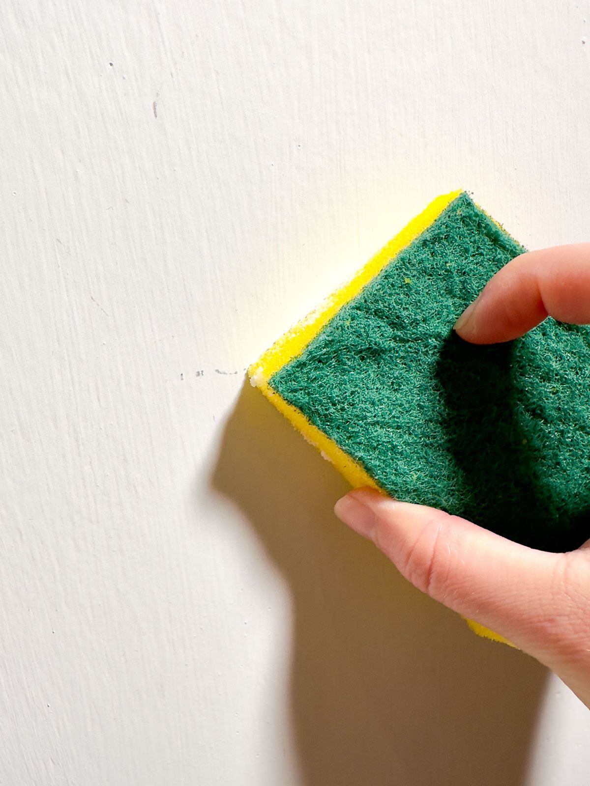 Remove Stains from the Wall with a Damp Sponge and Baking Soda