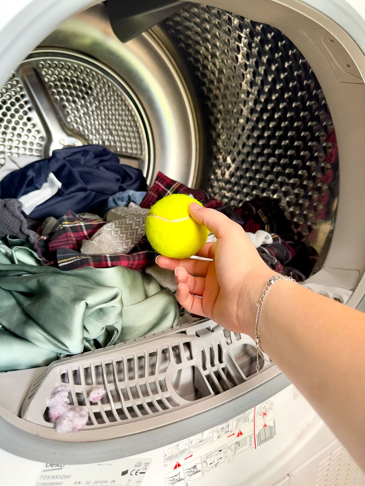 Place a Tennis Ball into the Dryer to Dry Clothes Faster