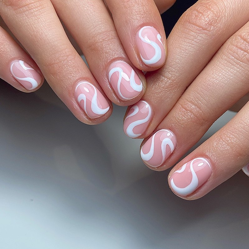 elegant white swirl nails