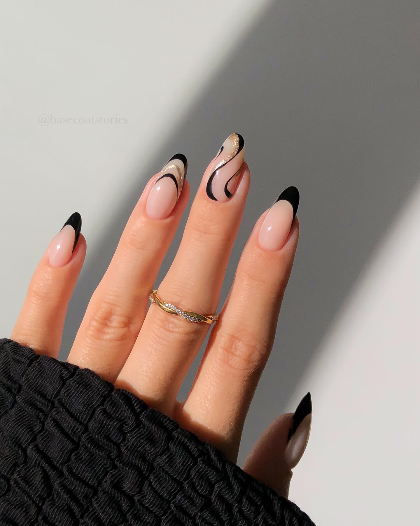 39. Nude Nails with Black and Gold Accents