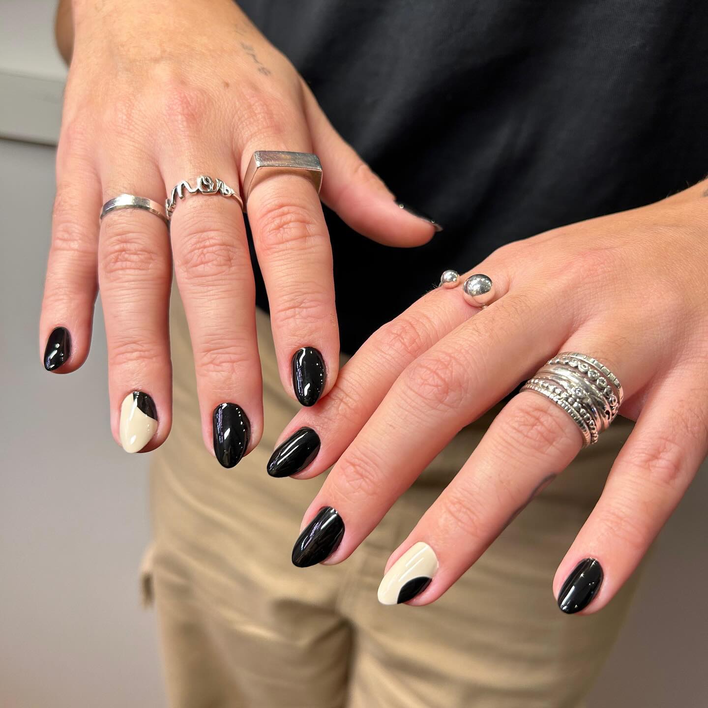 8. Black Minimalist Manicure with a White Accent